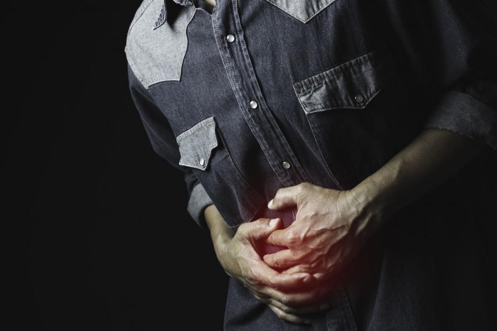 Боль в районе пупка у мужчин